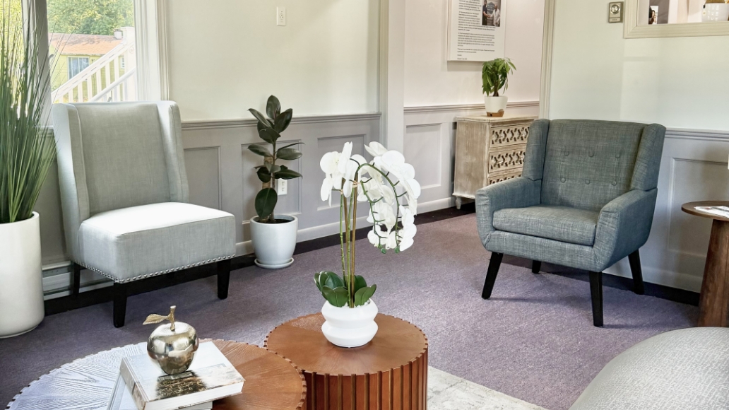 Couches and chairs inside dental office waiting room
